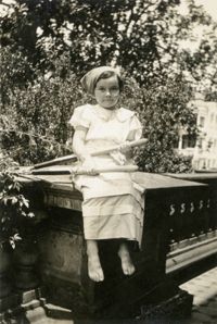 Girl in costume on porch of Main Library (1)