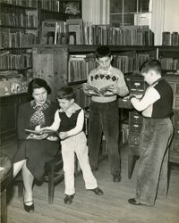 Family reading at Main Library