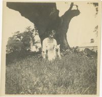 Woman in Grass with Pets