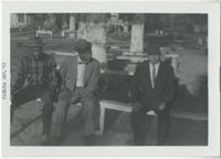 Three Men Sitting on Bench, December 1961