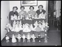 Four Women Posing with Dolls