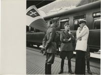 Mario Pansa and military officials at a train station, Photograph 2