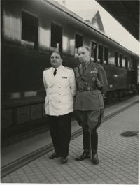 Military officials at a train station, Photograph 8