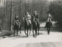 Mario Pansa and unidentified persons astride horses, Photograph 2