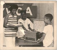 Photograph of and Adult and Two Children, June 23, 1971