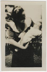 Photograph of a Woman Holding a Baby