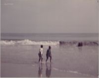 Photograph of Two People on a Beach