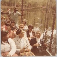 Photograph of a Group of People on a Boat