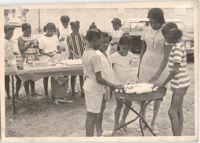 Photograph of Children Serving Food