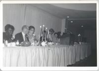 Photograph of People Seated at a Banquet Table