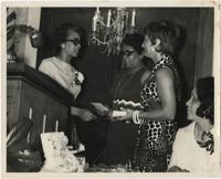 Photograph of Three Women at a Podium