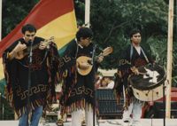 Fotografía de un trío de música folclórica boliviana actuando en el Festival Hispano en Palmetto Island Park  /  Photograph of Andean Music Trio, Hispanic Festival at Palmetto Island Park