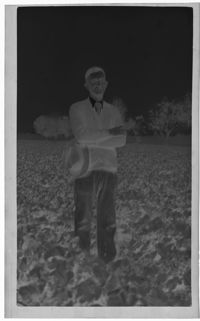 Negative of Man Wearing Cardigan in Field
