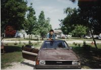 Fotografía de un joven y su carro  /  Photograph of Young Man and his Car