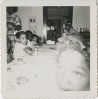 Photograph of Seated Children at a Dining Table