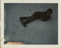 Photograph of Unidentified Child Lying on the Snow