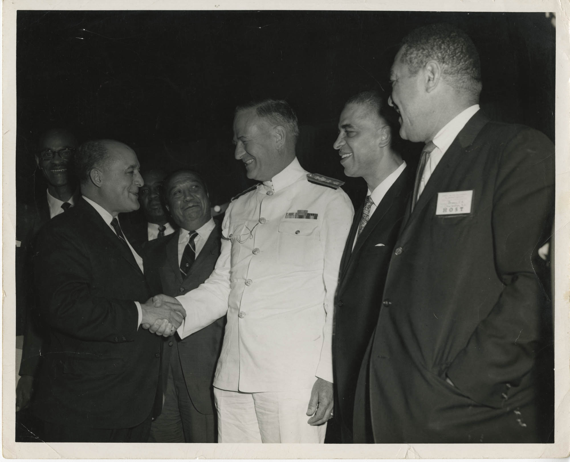 Photograph of Men Shaking Hands at 6th District Meeting of the