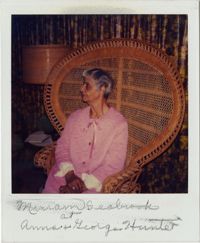 Miriam DeCosta Seabrook sitting in wicker chair