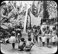 In a Papuan Village, New Guinea.