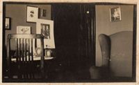 Room interior with family photographs on walls, probably the home of Christopher and Pauline Donner in Philadelphia