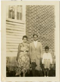 Miriam DeCosta Seabrook, Raymond T. DeCosta, and Hebert U. Seabrook, Jr. standing outside.