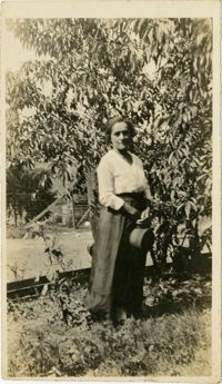 Woman standing in front of tree