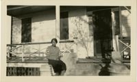 Woman sitting on porch
