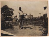 Portrait of unidentified black man in farmyard