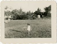 Girl standing in field